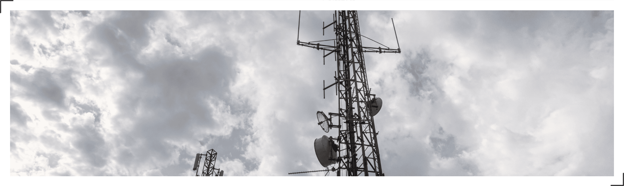 Tower with cloudy sky.